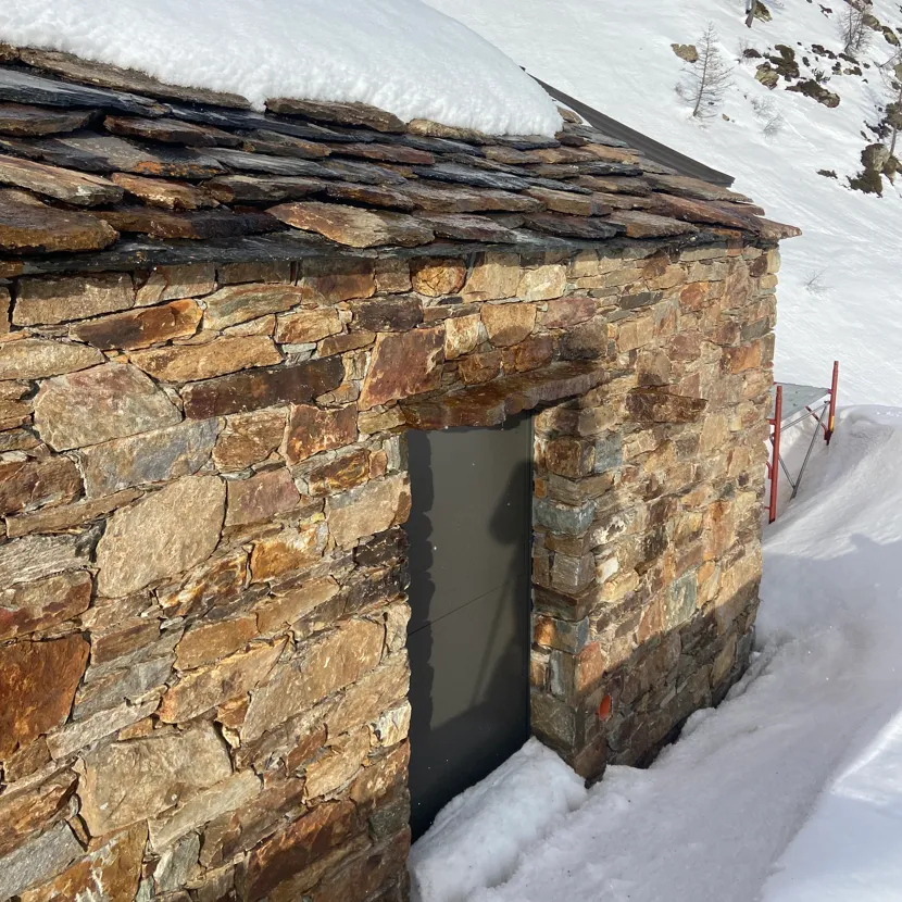 stone house in Piedmont Alps surrounded by natural landscape and hiking trails